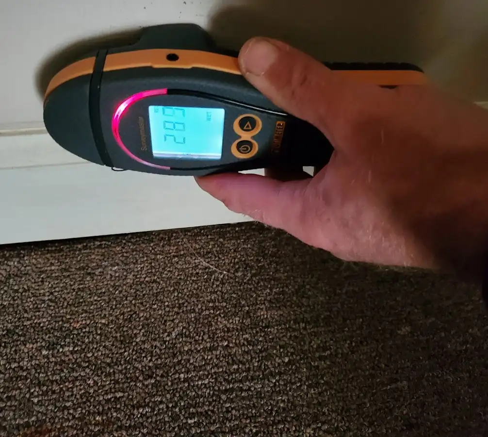Moisture detection at baseboard during Sewage Cleanup & Sanitation in Prairie Village